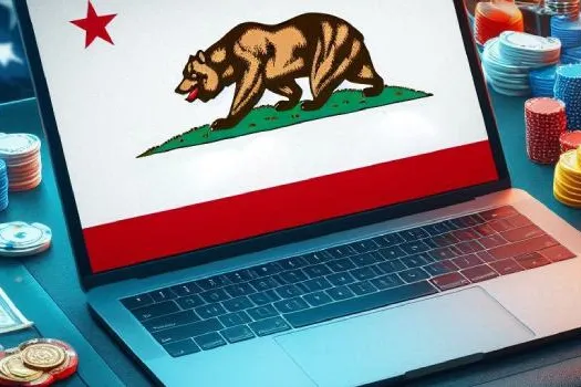 Bandera de California junto a un portátil, imagen que representa el debate sobre apuestas deportivas presenciales y online en el estado